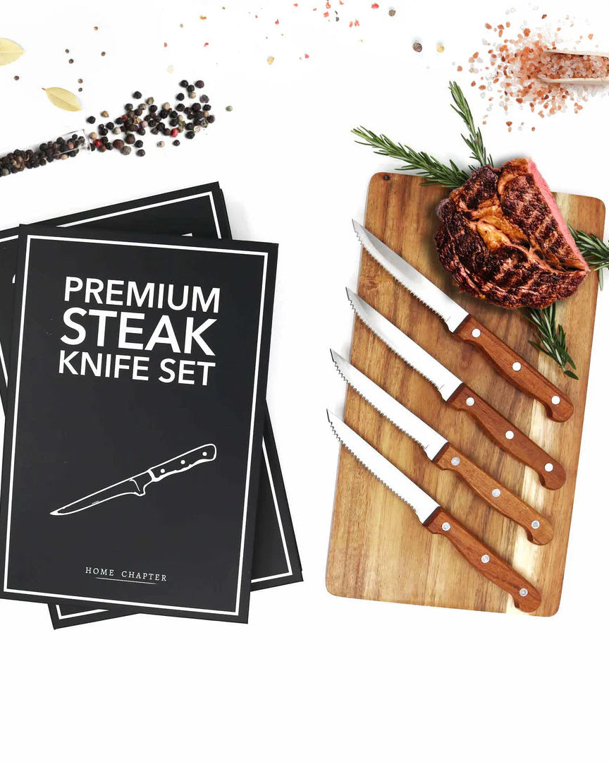 Premium steak knife set with wooden handles on a cutting board, accompanied by 'Premium Steak Knife Set' packaging.