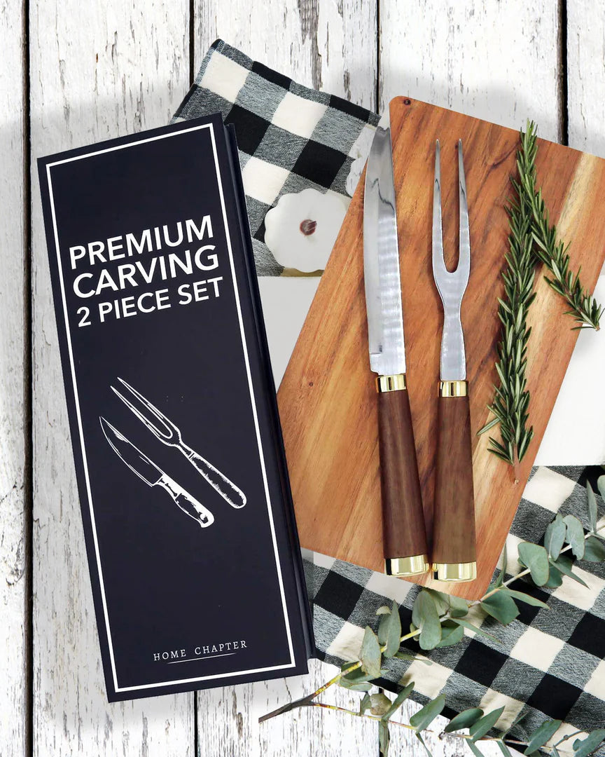 Premium carving knife and fork set on a wooden board with packaging labeled 'Premium Carving 2 Piece Set'.