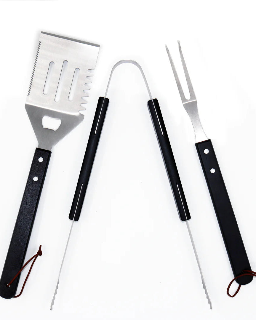 Set of three BBQ tools with black handles on a white background